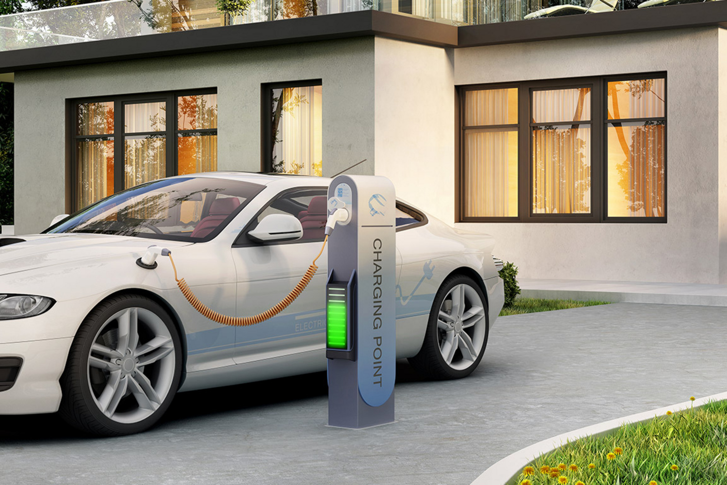 Elektroauto vor dem Haus beim Aufladen an einer Ladesäule